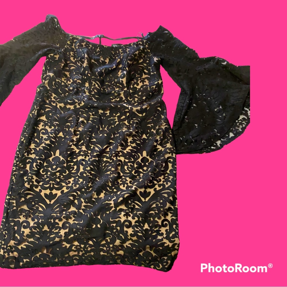 Beautiful black classy sexy dress. Beautiful 3/4 sleeve flare . Escape brand